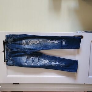 Medium wash destructed jeans